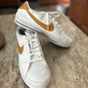 Nike White and Gold Women's Sneakers logo check